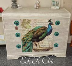 the chest is decorated with an image of a peacock