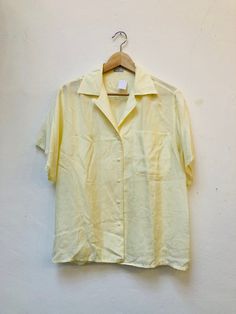 Please notice since we are a very small shop it's not possible for us to accept returns 🌼 Long Vintage Blouse/ Blouson Size M/L Silk Length from Shoulder to hem: 63cm Length from Armpit to Armpit: 55cm comfy and ready to wear ! Condition : good vintage condition * We check our clothes before we send them to you 🌼 * Feel free to write us if You have any questions 🌼 *Please always check measurements before buying * If something went wrong and you are not happy with your order: please  inform us Cheap Yellow Vintage Blouse, Satin Button Up, Yellow Satin, Vintage Blouse, Something Went Wrong, Blouse Vintage, Small Shop, Womens Clothing Tops, Button Up Shirts