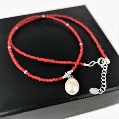 Elegant Red Beaded Necklace With Lobster Clasp, Red Pearl Necklace Gift, Red Beaded Pendant Necklace, Red Beaded Necklaces With Tiny Beads As Gift, Handmade Red Pearl Jewelry, Red Pearl Necklace With Gemstone Beads, Adjustable Red Pearl Necklace, Handmade Red Coral Pearl Necklace, Red Beaded Necklaces As A Gift