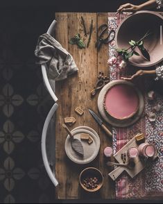 the table is covered with dishes and utensils