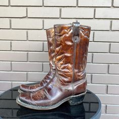 Vintage Wrangler Square Toed Brown Leather Cowboy Boots, Size Women's 8D Made in the USA Fit seems true to size They Measure 11 Inches from toe to heel This item is vintage/used. Please view pictures as part of the description, all vintage items are final sale. Check out my other cool vintage finds at : https://www.etsy.com/ca/shop/thatssothrifted Wrangler Vintage, Vintage Cowboy Boots, Vintage Cowboy, Vintage Wrangler, Leather Cowboy Boots, Cowboy Cowgirl, Boots Womens, View Pictures, La Girl