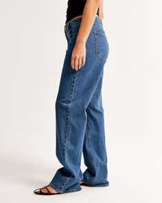 Our Curve Love low rise baggy jeans in a dark marble wash with a clean hem. This fit features a 8.5” low rise, is slightly relaxed at waist and hips, and eases at the thigh into a baggy, full-length leg shape. Our Curve Love styles add an additional 2” at the hip and thigh to allow room for your curves and eliminate waist gap. This jean is made from our vintage stretch fabric which features both an authentic vintage look and contains slight built-in stretch for additional comfort. Trendy Dark Wash Relaxed Fit Flare Jeans, Trendy Relaxed Fit Dark Wash Flare Jeans, Relaxed Fit Rigid Denim Bottoms With Straight Hem, Classic Denim Blue Bottoms With Frayed Hem, Casual Cutoff Flare Jeans In Rigid Denim, Relaxed Fit Denim Blue Flare Jeans, Denim Blue Relaxed Fit Flare Jeans, Relaxed Fit Dark Wash Jeans With Frayed Hem, Casual Rigid Denim Cutoff Flare Jeans