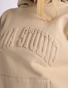 Stay cosy and stylish with the Kaiia Studio Embossed Logo Oversized Hoodie in Stone. Made from soft. high-quality material. this hoodie features a unique embossed logo design that adds a touch of flair to any outfit. Perfect for lounging at home or running errands. this hoodie will be your new go-to for comfort and fashion. Model is 5ft6 and wears size UK 8 Fabric composition: 70% cotton. 30% polyester Wash on low temperature with similar colours and fabrics MHOO3598 Embossed Hoodie, Print Techniques, Oversized Hoodie, Grab Bags, Oversize Hoodie, Embossed Logo, Platform Boots, Fashion Model, Emboss