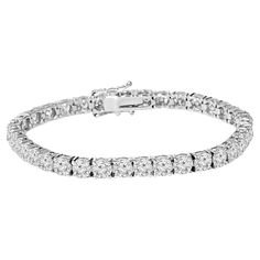 14K White Gold with 2.75TCW Diamond Tennis Bracelet Add a touch of elegance and luxury to your jewelry collection with this stunning 14k white gold bracelet. This bracelet features 92 round brilliant cut diamonds of total carat weight of 2.75 TCW G SI diamonds, making it a truly breathtaking piece. Approximately 7 inches in length "The perfect accessory for any occasion, this timeless piece will add a touch of elegance to any ensemble." Please note, when item is out of stock it takes 2-3 weeks a Bracelet Tennis, Gold G, Diamond Bangles Bracelet, Diamond Tennis Bracelet, White Gold Bracelet, Fine Jewelry Bracelets, Tennis Bracelet Diamond, Diamond Bracelets, Wedding Bracelet