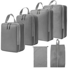 four pieces of luggage with zippers on each side and two bags in the middle