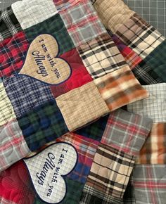 several different colored plaid shirts with hearts on them and the words i love my family printed on them