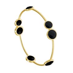 Dress up your wrists with this beautiful range of bangles in the Rosie collection. This brilliant range of gemstone bangles will not fail to catch your eye. The collection offers a multitude of gemstones such as this vibrant black onyx. Smart and modern, this bangle combines seven black onyx gemstones which have been slightly raised and set in a round faceted design. The bangle is exquisite, sturdy and is the epitome of understated refinement, and would make the perfect gift. The bangle measures 65mm in diameter. It is also available in silver plate. The bangle is made from gold plate and is hypoallergenic. Luxury gift wrapping available. To care for your jewellery, wipe gently with a soft and clean damp cloth. Do not soak in water. Avoid contact with soaps, detergents, perfume, sea water Elegant Adjustable Stones Bangle, Elegant Adjustable Bangle With Stones, Modern Gemstone Bangle Jewelry, Elegant Gemstone Bangle, Elegant Round Gemstone Bangle, Modern Stackable Round Bracelets, Elegant Bangle With Stones, Elegant Round Bangle With Stones, Modern Black Bangle