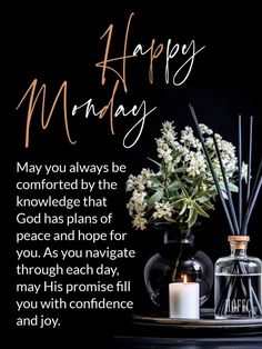 a vase with flowers and candles sitting on a table next to an inscription that says happy monday