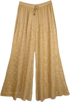 Easy Going Casual Everyday Lounge Pants in Twine Color - Chic meets sweet in our classic embroidered rayon pant with an elasticated drawstring waistband. These luxurious soft and stretchy mid weight pants made with soft flowy rayon have a hippie boho vibe and are comfortable for casual summer beach wear or running errands around town. The pants have delicate embroidery with similar thread all around the pant. This classic pant can be effortlessly dressed up or down for a summer-ready look. A rel Embroidered Straight Beige Pants, Beige Embroidered Straight Pants, Embroidered Wide Leg Beige Pants, Embroidered Beige Wide Leg Pants, Embroidered Wide-leg Beige Pants, Beige Floral Embroidered Pants, Summer Embroidered Beige Pants, Stretch Embroidered Wide Leg Bottoms, Embroidered Stretch Wide Leg Bottoms