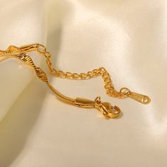 Discover Elegance with Our Minimalist Snake Chain Bracelet Introducing the perfect blend of luxury and durability: our 18k Gold Plated Stainless Steel Snake Chain Bracelet. Crafted with precision and designed for those who appreciate understated elegance, this bracelet is a versatile accessory suitable for any occasion, from gala events to casual gatherings. Key Features & Craftsmanship This exquisite piece features a minimalist snake chain design that offers both comfort and style. Made from high-quality stainless steel and adorned with an 18k gold PVD plating, the bracelet is built to last. Its waterproof nature ensures that you can wear it anywhere, from a day at the office to a night on the town, without worrying about damage. The hypoallergenic properties guarantee that it’s safe for Elegant Metal Charm Bracelet With Delicate Chain, Gold Plated Elegant Snake Chain Bracelet, Elegant Gold-plated Snake Chain Bracelet, Gold Adjustable Link Chain Bracelet, Elegant Gold Plated Snake Chain Bracelet, Gold Bracelets With Lobster Clasp For Wedding, Elegant Gold Snake Chain Bracelets, Elegant Gold Bracelet With Snake Chain, Yellow Gold Snake Chain Bracelet With Adjustable Chain