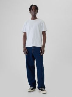 Fit: Extra roomy through the hip & thigh.  Made with a baggy, slightly tapered leg that stacks at your shoes.  Fabric: 13 oz 369 g) rigid denim.  Stretch: No Stretch.  Authentic rigid denim that gets better with every wear.  Made to wear all day & break in over time.  Look: A classic five-pocket jean in a dark wash.  Details: Zip fly & five-pocket styling.  Responsibly Made: This pair of jeans is part of our water-saving Washwell program.  Compared to conventional wash methods, Washwell has saved millions of liters of water since 2016.  Our Mid Rise Jean has a 12. 75″ 32 cm) rise.  Sits below the waist with a longer rise.  Baggy through the hip & thigh.  Loose, slightly tapered leg.  Longer inseam that stacks at the hem. ​ 18″ 46 cm) leg opening. ​ Models are 6′1″–6′2″ 185 cm–188 cm) with Baggy Levis Jeans, Guy Jeans Outfit, Athletic Street Style, Guys Fits, Male Style, Mens Trendy Outfits, Chill Fits, Boy Fits, Mens Outfit Inspiration