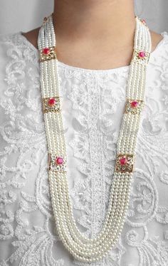 These Rani Haar Malas are Multi-layered strands of lustrous pearls intricately designed with gold detailing, perfect for weddings, festivals, and grand celebrations. Each piece is meticulously handcrafted by skilled artisans, ensuring superior quality and intricate designs. Our jewelry complements both traditional Indian and Pakistani attire and contemporary outfits, making it a versatile addition to your collection. 💖 Why Choose Us? *Authenticity: We use high-quality materials to ensure each p Multi-strand Pearl Necklace For Wedding, Pearl Necklace With Pearl Chain For Festivals, Bohemian Pearl Necklace For Party, Pearl Chain Necklace For Celebrations And Festivals, Pearl Necklace With Pearl Chain For Celebrations And Festivals, Festive Pearl Necklace With Pearl Chain, Gold Long Pearl Bridal Necklace, Festive Beaded Pearl Necklaces With Pearl Drop, Festive Gold Pearl Necklace With Charm