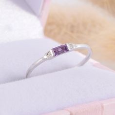 925 sterling silver small & delicate womens promise ring, Tiny petite silver amethyst promise ring for her,Baguette cut purple amethyst ring WE OFFER UNLIMITED PERIOD INSTALLMENTS PLAN This is a beautiful, stunning, feminine ring that works well for all occasions, styles, and ages. You will love it! Ring information: Main stone: Amethyst Approximate size: 4x2mm Accent stones: Cubic zirconia Approximate size: 1.25mm (2 stones) Approximate width of Band 1.2mm Metal type: Silver Metal stamp: 92 Cute Promise Rings, Fantasy Ring, Promise Ring For Her, Purple Amethyst Ring, Fancy Gifts, Promise Rings For Her, Purple Band, Rose Gold Band, Silver Wedding Rings