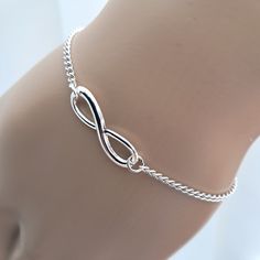 Infinity bracelet. A silver plated fine chain bracelet with silver plated infinity connector attached. Bracelet is available in several lengths, each having a 1.5 inch extender chain and fastening with a lobster clasp. Please choose your required length from the drop down menu. 7 inches is standard length for a bracelet.  Simple yet elegant, this dainty little bracelet makes a great gift for a loved one. Supplied in an organza gift bag.  Please note my jewellery may contain small amounts of nick Simple Silver Bracelet, Infinity Bracelets, Silver Infinity Bracelets, Nickel Allergy, Bracelet Simple, Silver Anklets, Jewelry Lookbook, Organza Gift Bags, Stylish Jewelry