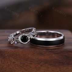 Here we have a Unique black onyx couples ring silver art deco wedding ring set nature inspired vintage anniversary rings for Men and Women black rings. ITEM DESCRIPTION ✦ Handmade, high-quality item! ✦ Material: Sterling Silver/10K/14K/18K/Platinum ►Sold as a two-piece set ►His ring is Sterling silver with black onyx ►His band width: 6mm ►Her ring is 925 solid Sterling Silver.(can be made in 10/14/18k white/rose/yellow/black gold) ►Center stone: 5mm round cut black onyx ►Accented with amethyst T Silver And Black Wedding Ring, Couple Rings Silver, Vintage Anniversary Rings, Onyx Ring Men, Vintage Anniversary, Deco Wedding Ring, Art Deco Wedding Ring, Jewelry Product Shots, Couples Ring