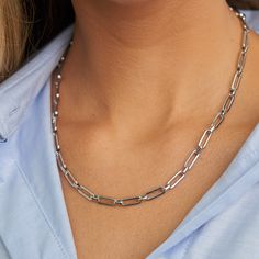 PRODUCT DETAILS Water resistant 💧 Brass White Rhodium Gold Filled Chain Hypoallergenic Nickel Free Size:16'' in length + 3" Extender - 5mm width. DESIGNER NOTE A minimalist masterpiece that blends contemporary design with timeless elegance. STYLE TIP: Elevate your everyday look by pairing this chain with other delicate chains of varying lengths, allowing you to achieve a trendy and personalized layering style. Layering Style, Paperclip Chain Necklace, Elegance Style, Layered Fashion, Gold Filled Chain, Paper Clip, Everyday Look, Free Size, Contemporary Design