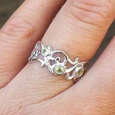 Beautiful 14k white gold ring set with three green peridot. Personally, paisley is one off my favorite shapes. It inspired me to create a piece, which would be full of air, romantic and beautiful. A 14k yellow gold ring, set with three beautiful 2.5 mm green peridot. Will make a beautiful gift for you or your loved ones.  ----------------------------------------------------------------- * Can be set with any other color of stones that you choose.  ------------------------------------------------ Ring Three Stone, Three Stone Ring, Peridot Ring, Green Peridot, 14k White Gold Ring, White Gold Ring, Three Stone Rings, Multi Stone Ring, Ring Gold