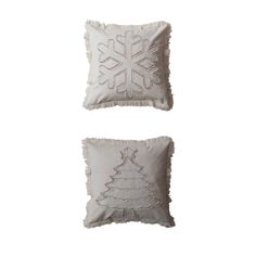 two white pillows with snowflakes on them