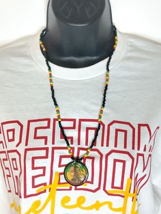 Introducing...the ultimate accessory for fans of legendary reggae roots singer, Bob Marley - beaded necklaces in classic red, yellow and green Rasta colors! These Jamaican-inspired chains will add a touch of island vibes to any outfit. Get your rasta bead neck chain today and show off your love for Bob Marley in style! Elevate your style with these Bob Marley Beaded Necklaces, Featuring a bold Red, Yellow and Green Rasta chain. The pendant, measuring 1.5 inches, is made of vibrant acrylic Pendan Casual Multicolor Jewelry With Black Beads, Casual Black Bead Jewelry For Festivals, Casual Yellow Jewelry For Festival, Festival Necklaces With Adjustable Chain And Round Beads, Multicolor Festival Necklace With Adjustable Chain, Hippie Red Necklaces For Festival, Adjustable Red Hippie Necklace, Multicolor Adjustable Chain Necklace For Festivals, Hippie Green Round Bead Necklaces