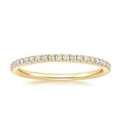 a yellow gold wedding band with white diamonds