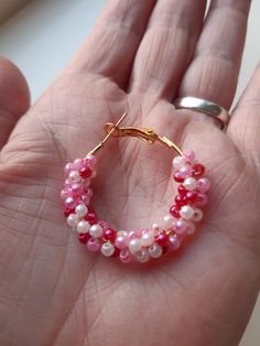 Gouden hoop earrings with 3 color pink small beads. I made the beads around the circle of the earring. The hoop earrings are of stainless steel, retain the color, and have a locked closure. The beads are 0,08 inches round long and the have the color, light pink, pink and dark pink. The earrings are of stainless steel and 1,18 inches round. These hoop earrings are light and comfortable to wear. These earrings are made with love. Beautiful summer earrings, the match any type of clothing. The jewel Pink Hypoallergenic Beaded Earrings With Round Beads, Pink Hypoallergenic Adjustable Beaded Earrings, Adjustable Hypoallergenic Pink Beaded Earrings, Colorful Beads Small Hoop Earrings, Colorful Beads Small Hoop Earrings For Gift, Colorful Beads Small Hoop Earrings As A Gift, Pink Hoop Beaded Earrings, Colorful Beads Small Hoop Jewelry For Gift, Handmade Pink Hoop Earrings Gift