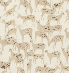 an animal print fabric with small deers in beige and black on off - white background