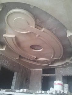 an unfinished ceiling in the middle of a building under construction with plaster and paint on it