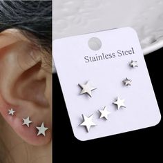 three pairs of star studs are shown next to each other