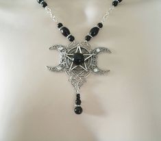 "This beautiful necklace has black obsidian beads, black czech glass beads, pewter silver accent beads, metal chain, sterling silver plated triple moon pendant, pewter silver pentacle and black obsidian stone. 18\" long. Sterling silver plated lobster clasp." Goddess Witch, Pentacle Necklace, Moon Pentacle, Wicca Jewelry, Wiccan Necklace, Black Obsidian Stone, Pentagram Necklace, Witch Necklace, Steam Punk Jewelry