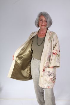 Japanese Kimono style loose fitting jacket in Sanderson's linen floral print Green satin lining Pockets fully lined Stone linen front and sleeve bands Loose fitting One off Back length 81 cm Sizes 12 - 16 All my jackets and coats are unique one offs. I am drawn to collecting various fabrics in small quantities. The colours or prints will speak to me as here in the very English Country Garden Sanderson linen. The soft green satin lining reflecting the greens of the garden. My jackets are inspired Elegant Spring Outerwear With Kimono Sleeves, Cream Kimono For Daywear In Spring, Cream Floral Print Outerwear For Fall, Spring Open Front Beige Kimono, Cream Linen Outerwear For Spring, Spring Beige Open Front Kimono, Cream Linen Spring Outerwear, Beige Open Front Kimono For Spring, Spring Cream Linen Outerwear