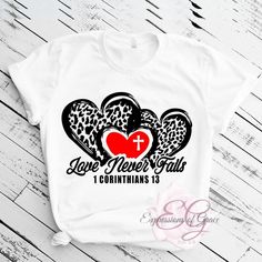 This stylish Love Never Fails Tee is sure to keep you comfortable and looking great. Show your faith and style with this white T-shirt, featuring a meaningful message inspired by 1 Corinthians 13:13. The tee is available in sizes small to 2XL, perfect for any individual. Share your love with the world in this lovely tee! Inspirational White Pre-shrunk T-shirt, Inspirational White Tops With Custom Print, Inspirational White Top With Custom Print, Inspirational Custom Print White Top, Comfy Jeans, Meaningful Messages, Love Never Fails, Custom Apparel, White T Shirt