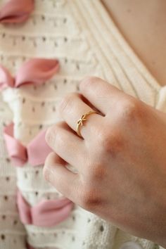 Is this not the cutest thing you have ever seen!? This cute little ring has a super dainty bow pendant design and is made with 18k gold plated brass. It is an adjustable ring which means it can be resized by gently pulling on the opening at the back of the ring(This ring best accommodates sizes 6-8). It is great quality, and tarnish resistant, and we absolutely promise it won't turn your skin green..... ever! Gold Rings Delicate, Minimal Ring Design, Bow Ring Gold, Simple Gold Rings For Women, Latest Ring Designs Gold For Women, Gold Rings Aesthetic Simple, Minimal Rings Gold, Simple Ring Designs Gold, Ladies Rings Gold Design