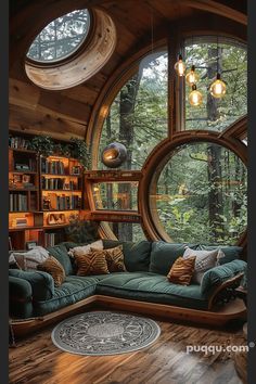 a living room filled with lots of furniture and large round windows over the top of it