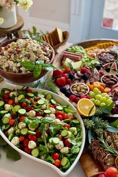 an assortment of fruits and vegetables are arranged on a platter, ready to be served