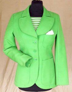 "Green wool/polyester jacket 1970, how stylish is this??!! Cool shade of lime Green that appears to have had fairly little wear but was never cleaned. Very continental styling as was common in all of Western Europe (where it was made) at this point. Love the rounded nature of the collar and patch pockets. Stated 38 I would put this as an 8-10 UK: 18\" p-p/ 15\" shoulder/ 15.5\" across waist/ 19\" across hips/ 23\" sleeve/ 26\" length. 50£ NB The outer garment is perfect, the inner shows dirt on the collar and lining. I can have this dry cleaned if asked before purchase or will leave it to you." Spring Green Blazer For Tailoring, Fitted Green Cotton Blazer, Fitted Green Outerwear With Pockets, Fitted Green Cotton Outerwear, Retro Green Outerwear For Spring, Casual Green Wool Blazer, Retro Green Spring Outerwear, Retro Green Blazer For Spring, Vintage Green Fall Blazer