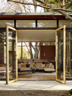 an open living room with sliding glass doors and wood flooring on the outside wall