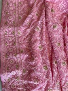 This Elegant And Gorgeous Chikankari Silk Saree is on Pure Georgette Silk! It has outstanding finished Lucknow Chikankari Embroidered with Mukaish and Gotapatti Embroidered work all over the body and Pallu!! **Perfect For Any Bridal / Big Party Occasions** Chikankari sarees are traditional Indian garments known for their intricate white-on-white embroidery work. They originate from Lucknow, India, and are prized for their craftsmanship and elegance. These sarees are often made from lightweight fabrics like cotton or chiffon and are adorned with delicate hand-embroidered motifs, making them popular choices for special occasions and weddings. Chikankari work can include various stitches and patterns, creating a unique and timeless look. Festive Pink Raw Silk Pre-draped Saree, Festive Pink Pre-draped Dola Silk Saree, Festive Pink Silk Pre-draped Saree, Pink Raw Silk Traditional Wear With Resham Embroidery, Pink Raw Silk Pre-draped Saree With Resham Embroidery, Pink Art Silk Pre-draped Saree With Intricate Embroidery, Pink Traditional Wear With Resham Embroidery, Pink Silk Bollywood Pre-draped Saree, Pink Chanderi Pre-draped Saree With Intricate Embroidery