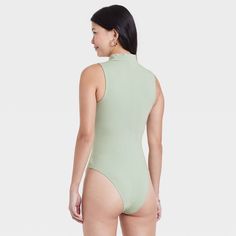 Refresh your separates closet as the seasons change with the Mock Turtleneck Tank Bodysuit from A New Day™. This sleeveless pull-on tank bodysuit is designed in elegant solid hues for a sophisticated look, and it features a mock turtleneck neckline for additional flair. The bodysuit is made from a soft and stretchy cotton-blend fabric to give you a comfortable fit that moves with you, and it boasts a full-coverage bottom with metal snaps at the crotch for added convenience and confident wear. We Mock Neck Bodysuit, Tank Bodysuit, Seasons Change, Short Torso, Long Torso, Versatile Outfits, Mock Turtleneck, Changing Seasons, Staple Pieces