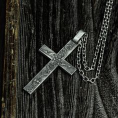 describe This 925 Silver Cross Necklace, Cross Pendant, Gothic Cross, Gothic Jewelry is cast in sterling silver and bronze and handcrafted to accentuate every nook and cranny of this wonderful sculpture. Pendant length approximately 62mm* width 32mm Note: Dimensions and weights are measured by hand and may vary. pack: All pieces come in custom gift boxes. If you would like to include a gift note, please let us know in the Notes section at checkout. Please click to view other products in our stor Antique Silver Etched Sterling Silver Necklace, Artisan Silver Engraved Necklaces, Antique Silver Hand Forged Sterling Silver Necklaces, Hand Forged Sterling Silver Necklace In Antique Silver, Hand Forged Antique Silver Sterling Necklace, Unique Sterling Silver Necklace For Memorial, Artisan Antique Silver Engraved Necklace, Artisan Engraved Antique Silver Necklace, Handmade Cross Jewelry Collectible