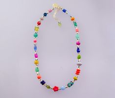 Brighten up your look with this colorful handmade necklace. It features a mix of vibrant Czech beads, natural gemstones, glass beads, and unique handpainted beads. Length: 16 inches with 2-inch adjustable chain. *Beads may vary slightly Colorful Adjustable Beaded Necklace With Polished Beads, Colorful Adjustable Beaded Necklaces With Polished Beads, Playful Multicolor Beaded Necklaces For Gifts, Vibrant Rainbow Beaded Necklace As Gift, Vibrant Rainbow Beaded Necklace For Gift, Colorful Beaded Crystal Necklace For Summer Gifts, Colorful Czech Glass Beaded Necklaces For Gifts, Multicolor Polished Czech Glass Beaded Necklaces, Multicolor Beaded Bracelets With Natural Stones