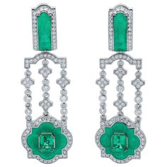 Emeralds Diamonds Enamel 18K White Gold Earrings Designers again beat our trademark "Tweed" texture in new Earrings. Shaped like a knightly order, these 18 Karat White Gold Earrings were ideally suited for "Tweed" texture. We added two octagon-shaped 0.97 Carat Emeralds and 200 Diamonds weighing 1.09 Carat to this combination. Also, there is transparent Enamel, carefully melted in the same Emerald color tone. The result was an unexpected duet of rigor and grace, and it gives these Earrings an in