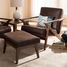 a living room scene with focus on the chair and footstool