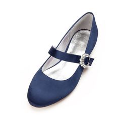 a pair of women's blue shoes with a jeweled buckle on the heel