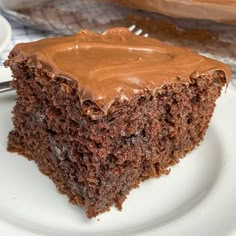 a piece of chocolate cake on a white plate