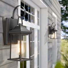 an outdoor wall light on the side of a house next to a door and window