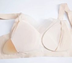 This mastectomy bra is perfect for after you've recovered from surgery and can lift you arms. There are large openings for holding prosthetics. It is made of a nylon spandex blend and is so soft, stretchy and seamless you will still want to wear if after your recovery. The padding is removable and a breast prosthetic can but put in its place. See size chart below or go with your normal shirt size. Size up if between sizes. Keep in mind that your cup size will not be the same after surgery. This Supportive Full Coverage Bra With Built-in Cups, Supportive Stretch Nursing Bra With Built-in Bra, Fitted Beige Bra With Light Support, Fitted Beige Sports Bra With Removable Pads, Full Coverage Nylon Nursing Bra With Built-in Bra, Supportive Fitted Nursing Bra, Beige Stretch Nursing Bra With Medium Bust Support, Beige Nursing Bra With Medium Bust Support, Stretch Nursing Bra With Light Support And Push-up Shape