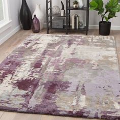 an area rug with various colors and shapes