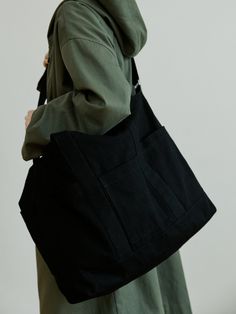 Editor's NotesThis canvas bag features detachable strap, sufficient storage space. It can be styled in various ways. For unisex.- Detachable strap for crossbody bag- Various pockets- Sufficient storage space- Button closureMeasurements(in.)One size- Length: 15.75 in.- Height: 25.98 in.- Width: 6.69 in.- Strap length: 47.24 in.Model info: MAN - 6' 1'' / WOMAN - 5' 6''Composition & Care- 100% Cotton- Please check the care labelDesigner- by malen Black Hobo Bag With Pockets For On-the-go, Black Hobo Bag With Pockets For Daily Use, Versatile Black Canvas Bag With Removable Pouch, Black Hobo Bag With Pockets For Travel, Versatile Black Hobo Bag With Pockets, Black Hobo Travel Bag With Pockets, Black Canvas Shoulder Bag With Pockets, Black Hobo Bag With Pockets For Everyday Use, Everyday Black Hobo Bag With Pockets