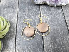 "These lightweight dangle earrings feature 18mm dark brown unfinished wooden discs dangling inside 25mm gold plated brass hoops. The ear wires are made of hypoallergenic gold plated surgical steel, making these earrings safe for sensitive ears! They are super lightweight, each weighing only 0.1 ounce. They measure approximately 1.75 inches from the top of the ear wires to the bottom of the gold hoop. Domestic shipping is always free here at Mayamadethis! When will my item ship? Every single item Brown Round Earrings For Pierced Ears, Round Wooden Earrings As Gift, Round Wooden Earrings For Gifts, Wooden Round Earrings For Gifts, Wooden Round Earrings Gift, Brown Wooden Round Earrings, Everyday Brown Wood Earrings, Brown Circular Earrings As Gift, Brown Circular Earrings For Gifts