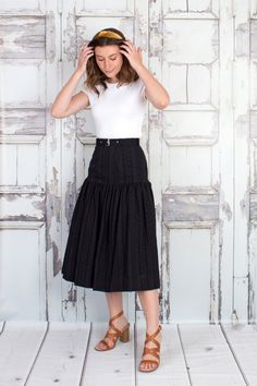 "High waisted midi skirt with fitted upper yoke and flared full bottom, matching belt and invisible zipper closure on back. Cotton eyelet body is fully lined with airy cotton voile to keep you cool and comfortable. Composition: 100% Cotton Lining: 100% Cotton Care: Dry clean recommended. Machine wash cool, hang to dry and medium to high iron. Garment Measurements: Laid Flat Waist: XXS - 24\"  XS - 26\"  S - 28\"  M - 30\"  L - 32\"  XL - 34\"  XXL - 36\" Laid Flat Hip: XXS - 34\"  XS - 36\"  S - Tiered Mini Skirt For Workwear, Black Lined Maxi Skirt For Work, Fitted Midi Pleated Skirt, Black Tiered Skirt For Workwear, Black Tiered Skirt For Work, Workwear Tiered Pleated Skirt With Lining, Fitted Pleated Midi Skirt With Lining, Fitted Midi-length Pleated Skirt With Lining, Fitted Midi-length Lined Pleated Skirt